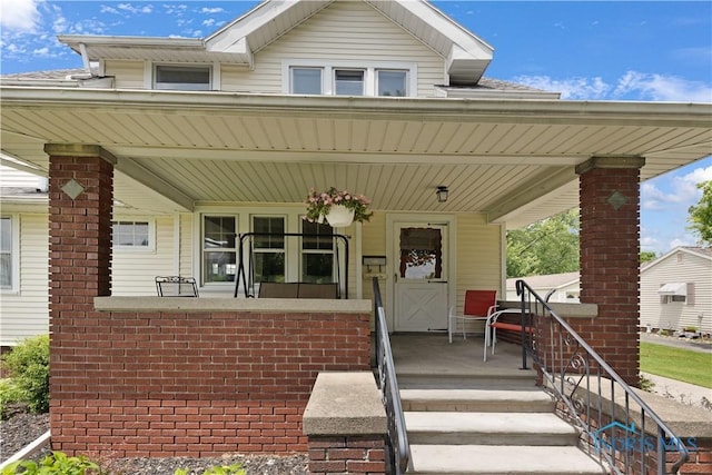 125 Cherry St, Wauseon, OH 43567 - view of front of home featuring covered porch and brick siding