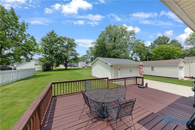 125 Cherry St, Wauseon, OH 43567 - wooden deck with a yard, an outdoor structure, outdoor dining area, and a residential view