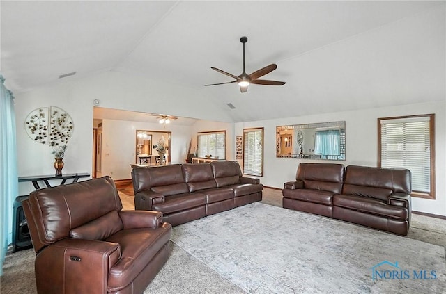 4871 Olde Meadow Ln, Sylvania, OH 43560 - carpeted living area with vaulted ceiling and a ceiling fan