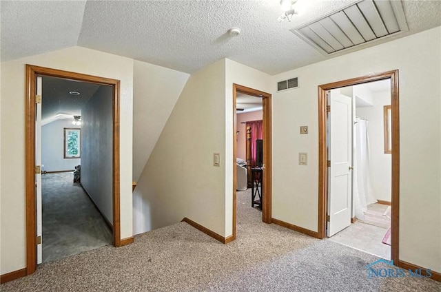 4871 Olde Meadow Ln, Sylvania, OH 43560 - corridor featuring carpet flooring, vaulted ceiling, and a textured ceiling