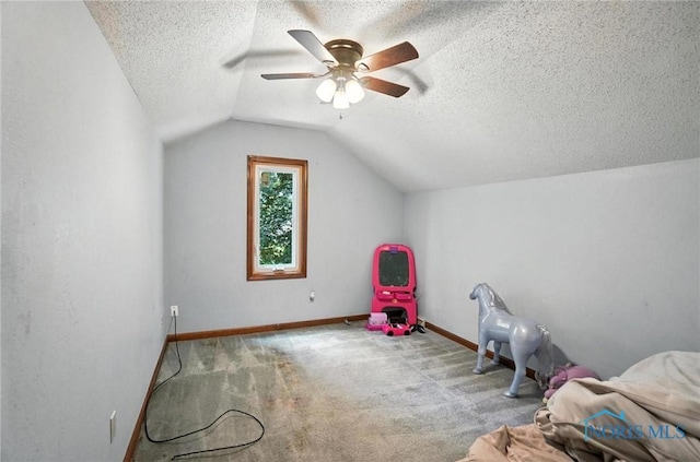 4871 Olde Meadow Ln, Sylvania, OH 43560 - recreation room featuring vaulted ceiling, a textured ceiling, ceiling fan, and carpet floors