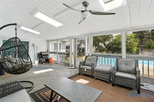 4871 Olde Meadow Ln, Sylvania, OH 43560 - sunroom / solarium with a skylight, a ceiling fan, lofted ceiling, and plenty of natural light