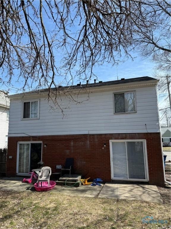 3031 Douglas Rd, Toledo, OH 43606 - back of property featuring a patio and brick siding