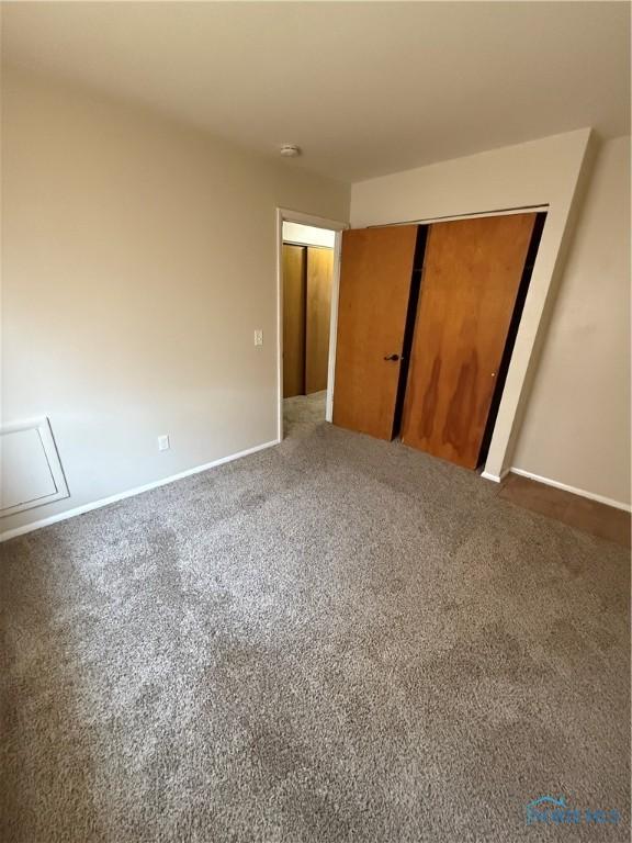 3031 Douglas Rd, Toledo, OH 43606 - unfurnished bedroom featuring a closet and carpet floors