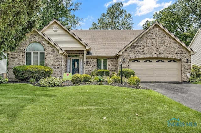 2923 Belle Glade Dr, Toledo, OH 43617 - ranch-style house with brick siding, a garage, driveway, and a front yard