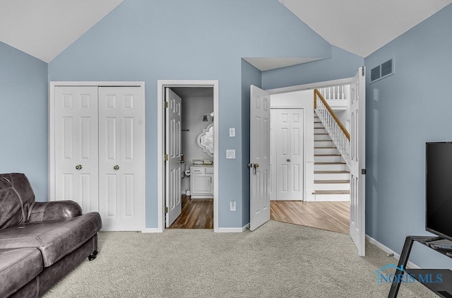 2923 Belle Glade Dr, Toledo, OH 43617 - carpeted living room featuring high vaulted ceiling and stairway