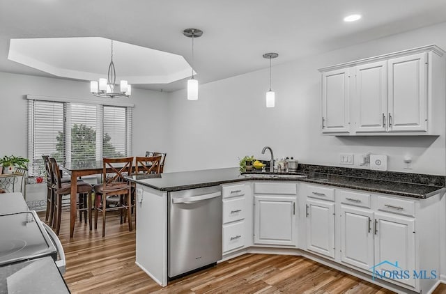 2923 Belle Glade Dr, Toledo, OH 43617 - kitchen with stainless steel dishwasher, light wood-type flooring, white cabinetry, a peninsula, and recessed lighting