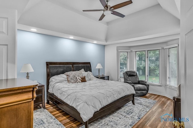 2923 Belle Glade Dr, Toledo, OH 43617 - bedroom with wood finished floors, a raised ceiling, recessed lighting, and a ceiling fan