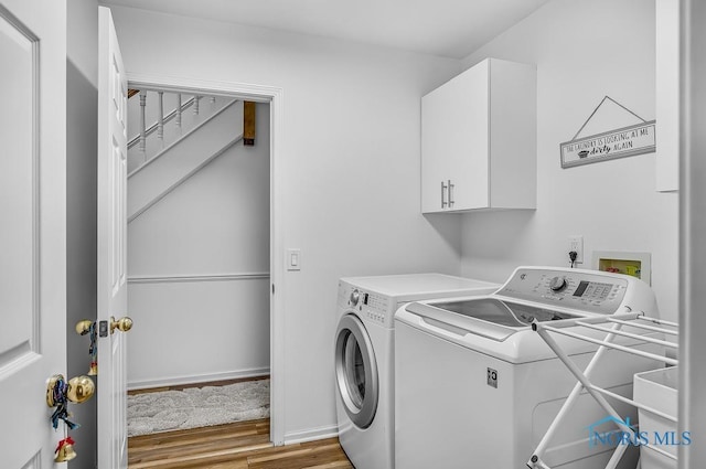 2923 Belle Glade Dr, Toledo, OH 43617 - washroom featuring cabinet space, independent washer and dryer, and light wood finished floors