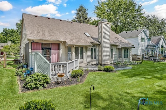 2923 Belle Glade Dr, Toledo, OH 43617 - rear view of property featuring a chimney, a shingled roof, and a patio
