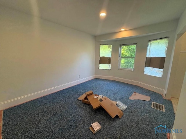 2631 Parkwood Ave, Toledo, OH 43610 - carpeted empty room with baseboards and recessed lighting