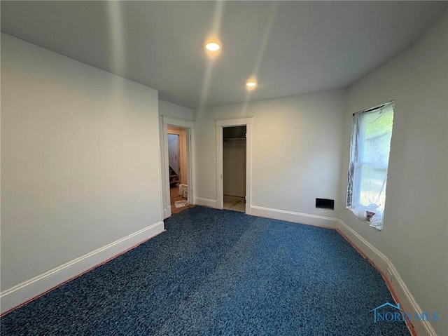 2631 Parkwood Ave, Toledo, OH 43610 - unfurnished bedroom featuring carpet floors, recessed lighting, and a closet