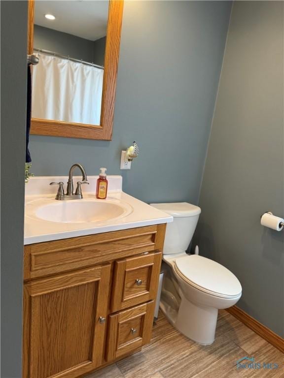 441 S Pine St, Deshler, OH 43516 - bathroom with vanity and wood finished floors