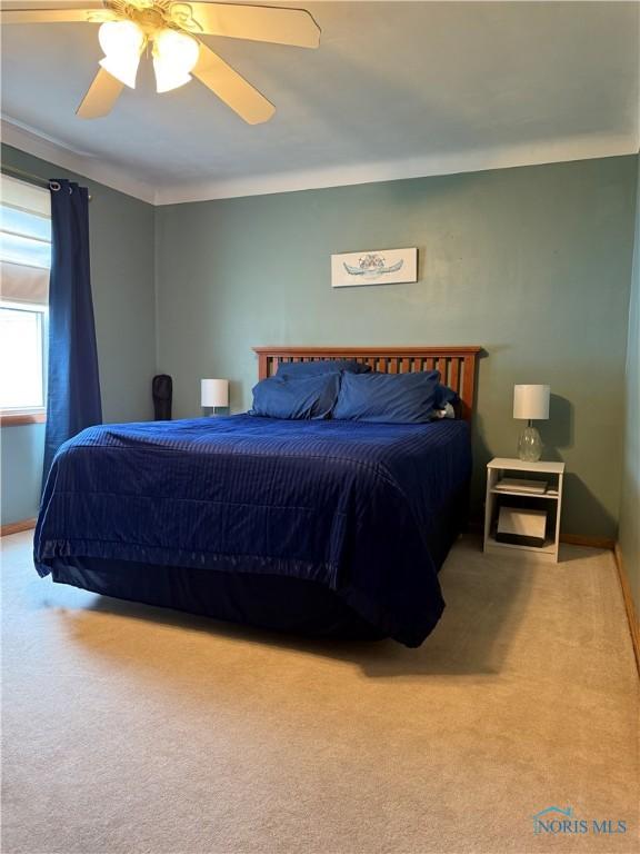 441 S Pine St, Deshler, OH 43516 - carpeted bedroom featuring ceiling fan and baseboards