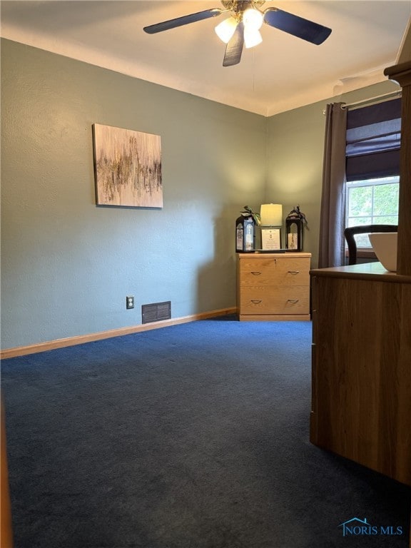 441 S Pine St, Deshler, OH 43516 - unfurnished bedroom featuring carpet flooring and a ceiling fan