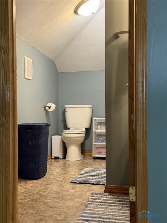 441 S Pine St, Deshler, OH 43516 - bathroom with lofted ceiling and tile patterned flooring