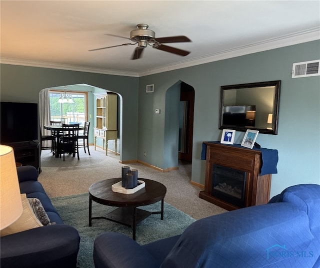 441 S Pine St, Deshler, OH 43516 - living room with arched walkways, a ceiling fan, carpet floors, crown molding, and a fireplace