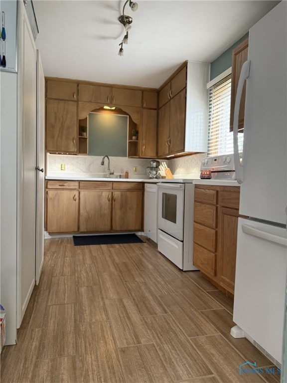 441 S Pine St, Deshler, OH 43516 - kitchen with white appliances, open shelves, light countertops, light wood-style floors, and decorative backsplash