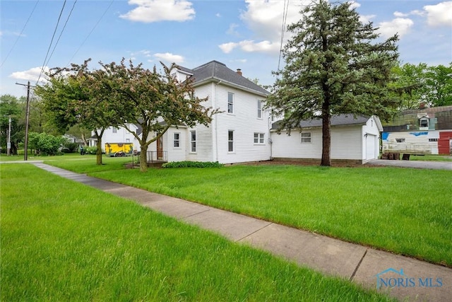22767 Defiance Pike, Custar, OH 43511 - view of home's exterior with asphalt driveway, a lawn, and a garage