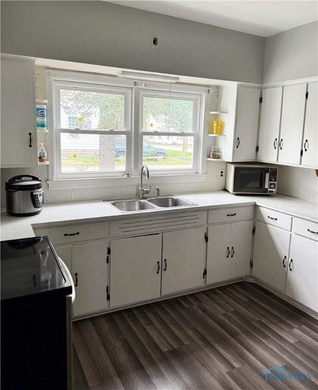 22767 Defiance Pike, Custar, OH 43511 - kitchen with dark wood-style flooring, white cabinetry, and light countertops