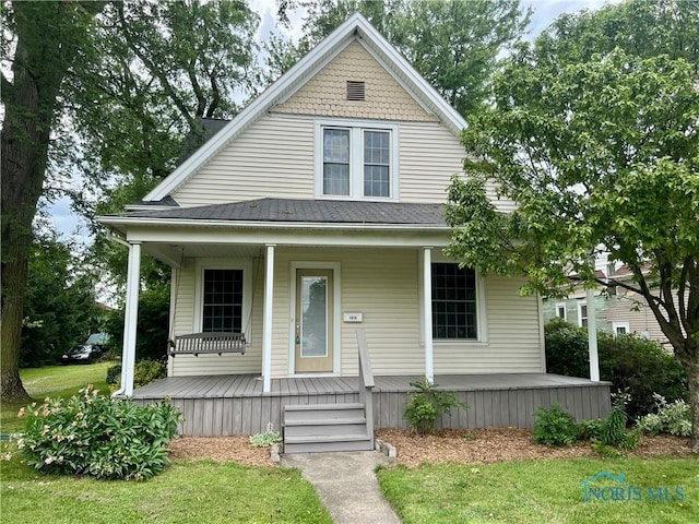 1810 E Broadway St, Toledo, OH 43605 - view of front of property with a porch and a front yard