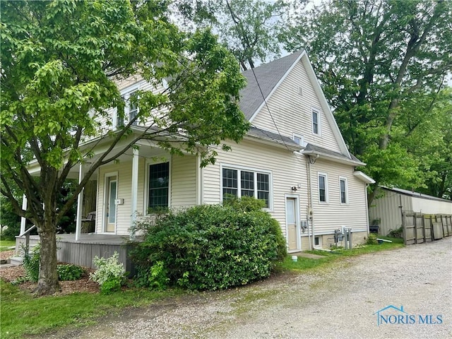 1810 E Broadway St, Toledo, OH 43605 - view of side of home featuring covered porch
