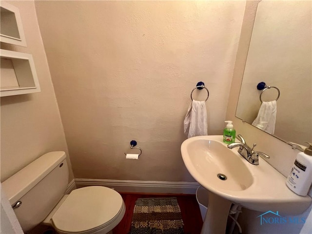 1810 E Broadway St, Toledo, OH 43605 - half bath featuring baseboards and wood finished floors