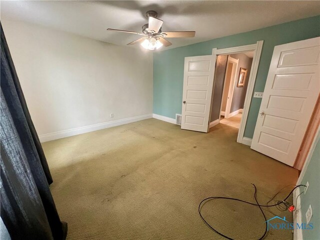 1810 E Broadway St, Toledo, OH 43605 - unfurnished bedroom featuring carpet floors and ceiling fan