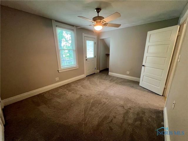 1810 E Broadway St, Toledo, OH 43605 - unfurnished bedroom with carpet flooring and ceiling fan
