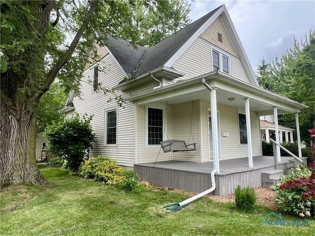 1810 E Broadway St, Toledo, OH 43605 - view of front of property with covered porch and a front lawn