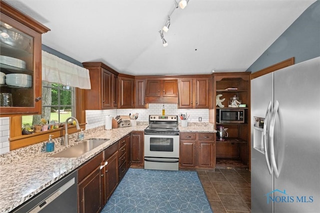 2617 Shetland Rd, Toledo, OH 43617 - kitchen with stainless steel appliances, lofted ceiling, open shelves, backsplash, and light stone countertops