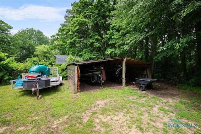 2617 Shetland Rd, Toledo, OH 43617 - view of parking / parking lot featuring a carport