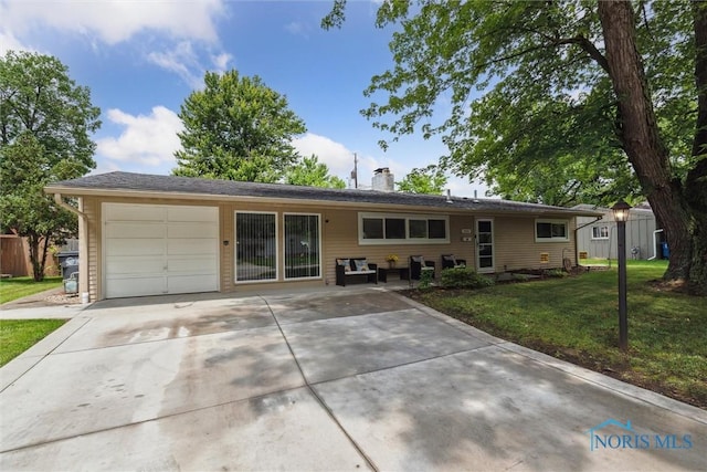 3530 Devon Hill Rd, Toledo, OH 43606 - single story home with an attached garage, a front lawn, concrete driveway, and a chimney
