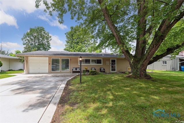 3530 Devon Hill Rd, Toledo, OH 43606 - single story home with a garage, driveway, and a front lawn