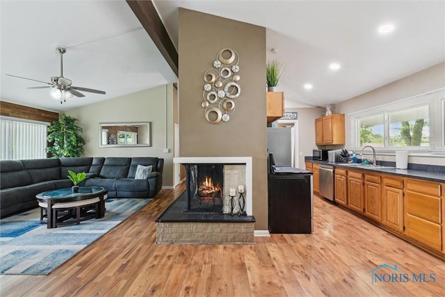 3530 Devon Hill Rd, Toledo, OH 43606 - living area with light wood-style floors, ceiling fan, a multi sided fireplace, and recessed lighting