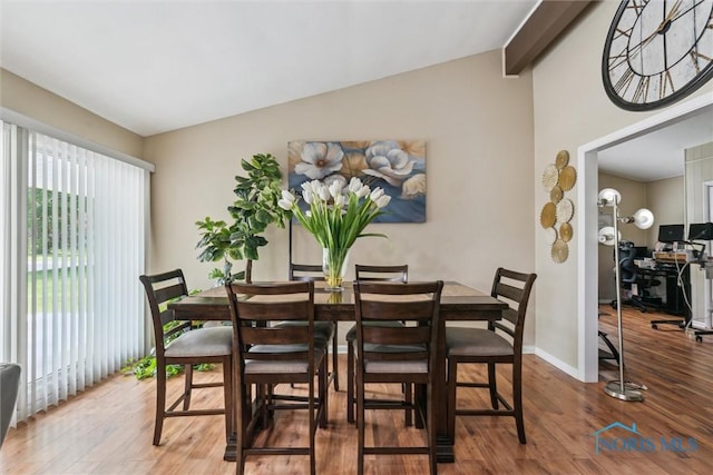 3530 Devon Hill Rd, Toledo, OH 43606 - dining space featuring vaulted ceiling, wood finished floors, and a desk