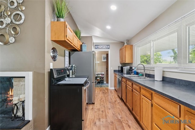 3530 Devon Hill Rd, Toledo, OH 43606 - kitchen featuring stainless steel appliances, light wood-type flooring, dark countertops, lofted ceiling, and recessed lighting