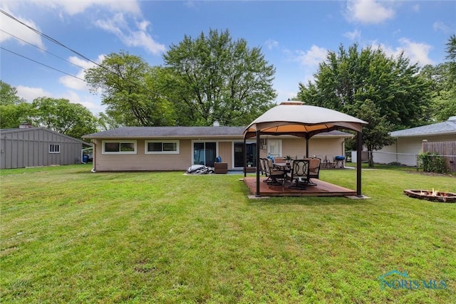 3530 Devon Hill Rd, Toledo, OH 43606 - back of property with a fire pit, a patio, and a gazebo
