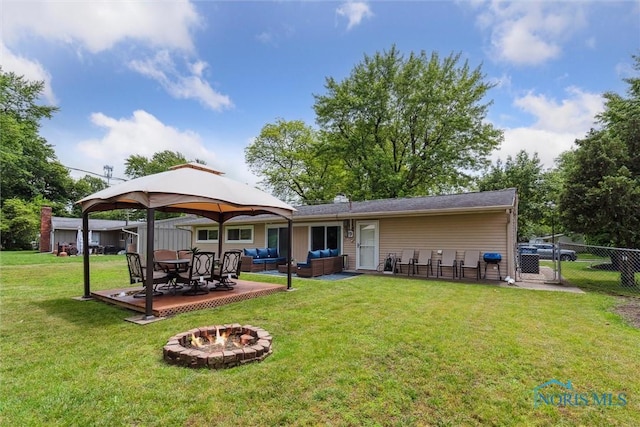 3530 Devon Hill Rd, Toledo, OH 43606 - rear view of property featuring an outdoor living space with a fire pit, a gazebo, and a patio