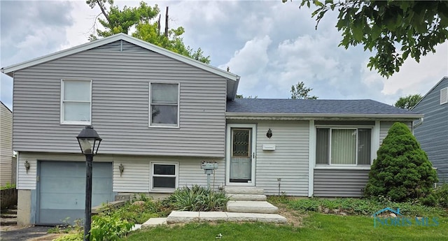 4745 Ottawa Trail Dr, Toledo, OH 43611 - tri-level home with a garage and entry steps