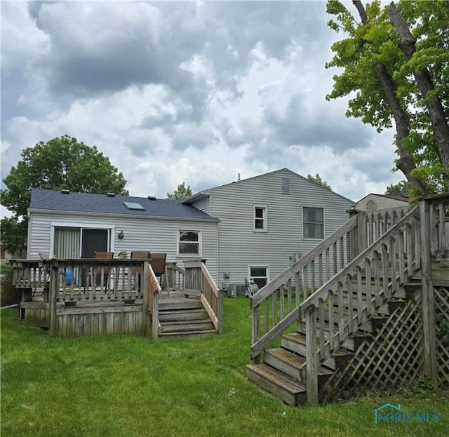 4745 Ottawa Trail Dr, Toledo, OH 43611 - back of property featuring a wooden deck, a yard, and stairs