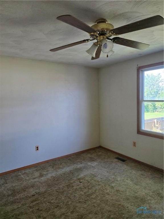 4745 Ottawa Trail Dr, Toledo, OH 43611 - carpeted empty room with baseboards and a ceiling fan