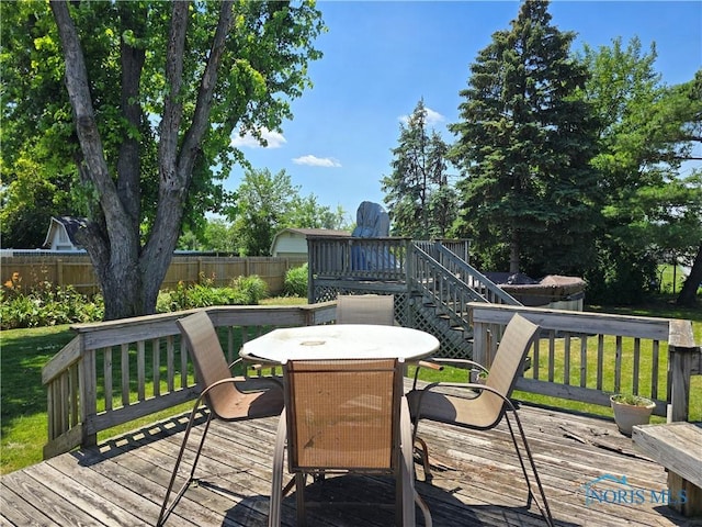 4745 Ottawa Trail Dr, Toledo, OH 43611 - deck with a fenced backyard, stairs, and outdoor dining space