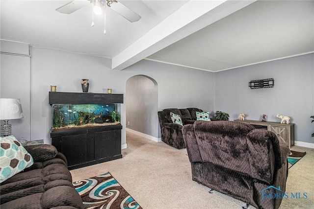 130 S 1st St, Hamler, OH 43524 - carpeted living area with arched walkways, ceiling fan, and beam ceiling