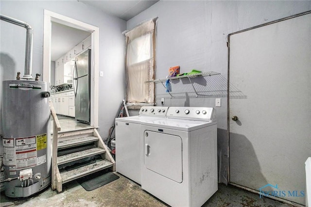 130 S 1st St, Hamler, OH 43524 - washroom with gas water heater and washing machine and clothes dryer