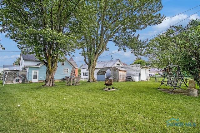130 S 1st St, Hamler, OH 43524 - view of green lawn with a storage unit