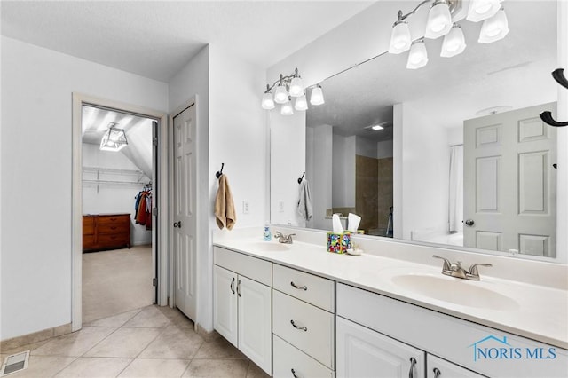 14285 Cuckle Creek Rd, Bowling Green, OH 43402 - bathroom featuring double vanity, tile patterned floors, a spacious closet, and a shower