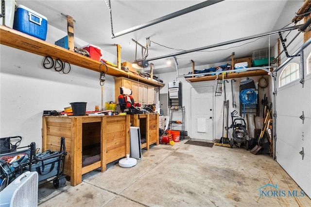 14285 Cuckle Creek Rd, Bowling Green, OH 43402 - garage with a workshop area and a garage door opener
