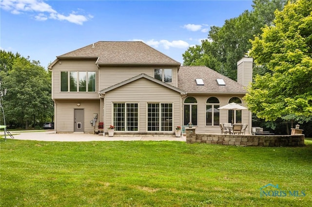 14285 Cuckle Creek Rd, Bowling Green, OH 43402 - rear view of property featuring a patio area, a yard, a chimney, and roof with shingles
