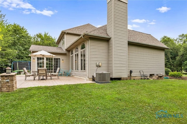 14285 Cuckle Creek Rd, Bowling Green, OH 43402 - rear view of property featuring a patio, a chimney, a yard, and roof with shingles